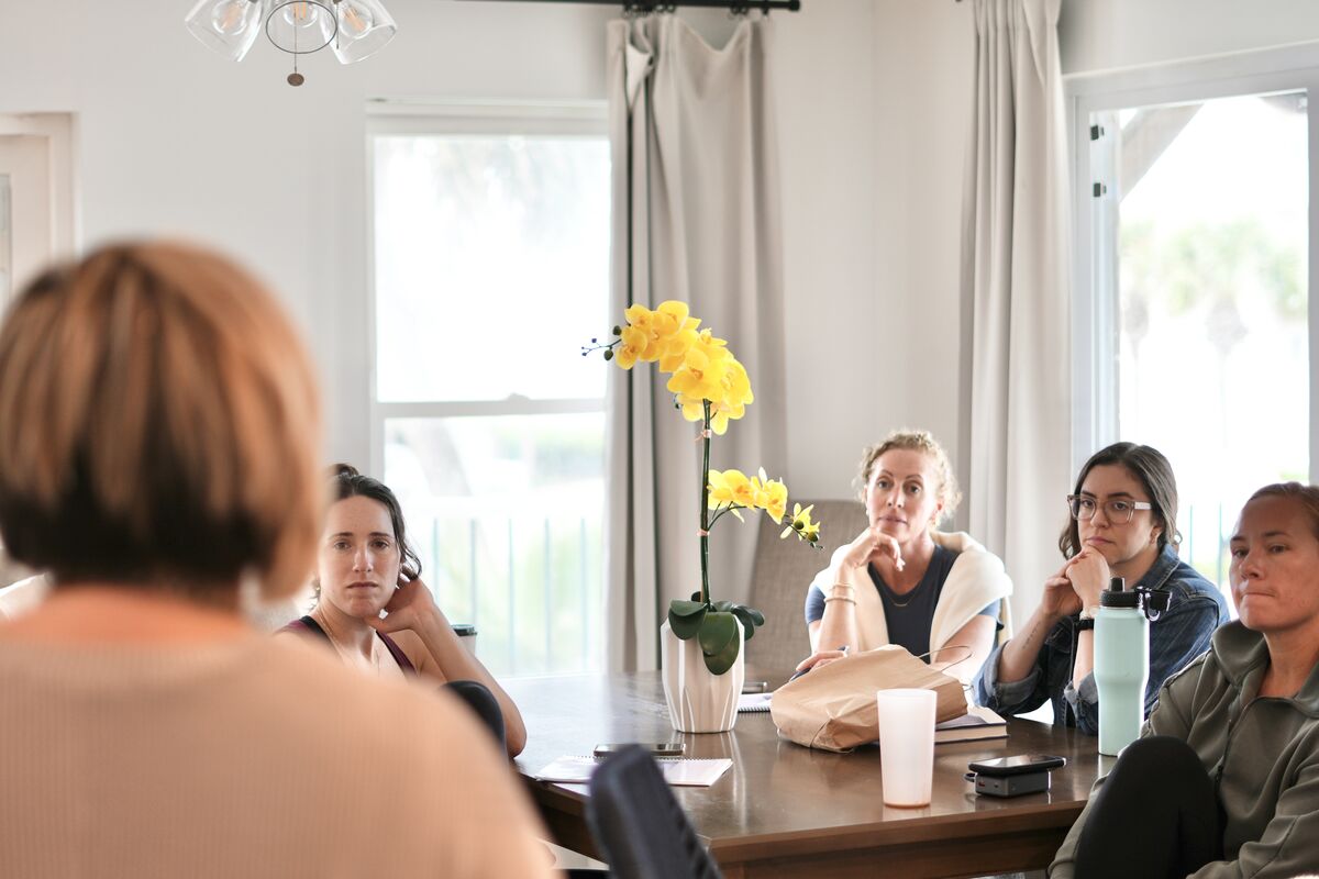 A circle of women gathered together at the retreat